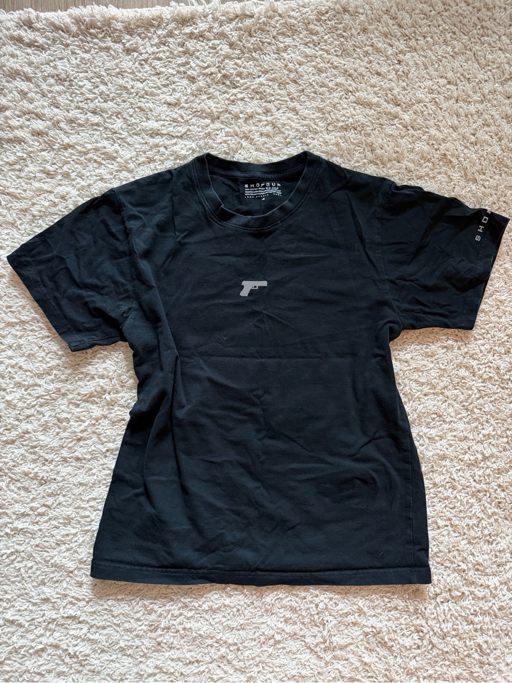 Black Short-Sleeve Graphic Tee with Minimal Pistol Logo